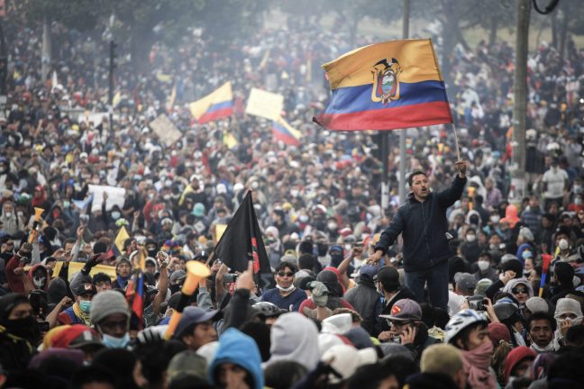 11 October 2019, Ecuador, Quito: Many people fly Ecuadorian flags in a massive protest against the government's economic policies. Indigenous peoples, trade unions and students protested against the abolition of fuel subsidies. The Moreno government had decided to take the measure in order to restructure the state budget within the framework of the conditions for a loan from the International Monetary Fund (IMF). Due to the unrest, the government declared a state of emergency. Photo by: Juan Diego Montenegro/picture-alliance/dpa/AP Images