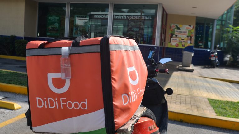 DiDi Food delivery bike parked in front of the Burger King take-away restaurant in the center of Merida.