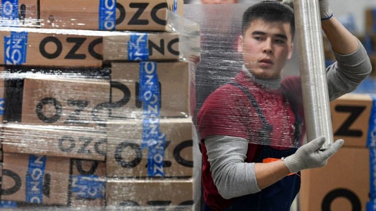 A worker at Russia online retailer Ozon's logistics centre, outside the town of Iver.