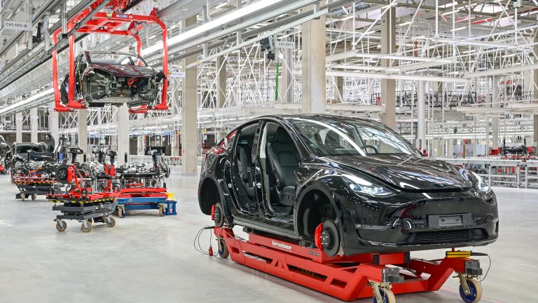 A Tesla Model Y is seen in a production hall of a Tesla Gigafactory