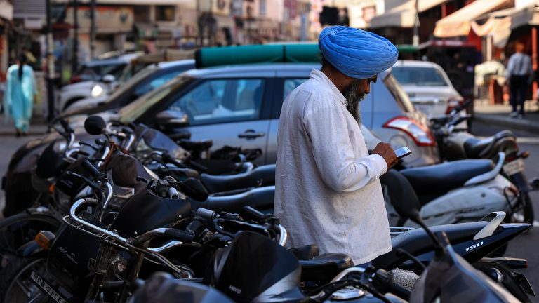 A Sikh man uses his cellphone in Amritsar Punjab India on 14 March 2023.