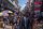 A photo of people walking through a crowded market street in Shillong, India.