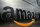 An enormous Amazon logo is set against a gleaming wall