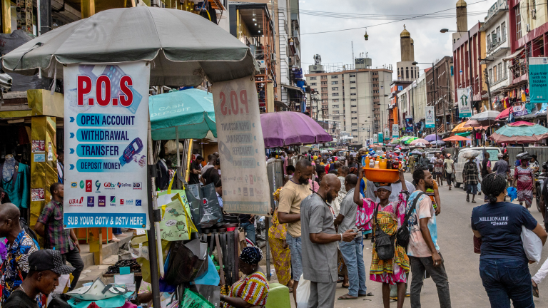 A photo showing a crowded intersection at a market in Lagos, Nigeria.